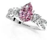 3 Stone Engagement Ring Setting for Fancy Pink Pear-Shaped Center with Pave Split Shank and Prong Head in Platinum