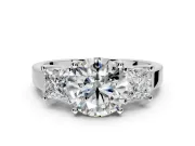 3 Stone Engagement Ring Setting for Round Cut Center with Matching Side Accents and Prong Head in Platinum