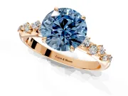 Cluster Engagement Ring Setting for Fancy Blue Round Cut Center with Round Cut Accent Band and Prong Head in Rose Gold