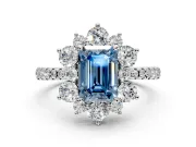 Floral Halo Engagement Ring Setting for Fancy Blue Emerald Cut Center with Pave Accents and Prong Head in Platinum