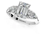 3 Stone Engagement Ring Setting for Emerald Cut Center with Large Pear-Shaped Accents and Prong Head in Platinum