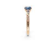 Cluster Engagement Ring Setting for Fancy Blue Cushion Cut Center with Round Cut Accent Band and Prong Head in Rose Gold