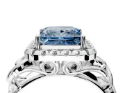 Halo Engagement Ring Setting for Fancy Blue Princess Cut Center with Open Scroll Shoulders and Prong Head in White Gold