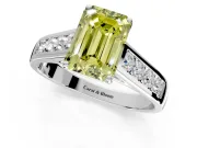 Solitaire Engagement Ring Setting for Fancy Yellow Emerald Cut Center with Round Cut Channel Band and Prong Head in Platinum
