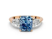 3 Stone Engagement Ring Setting for Fancy Blue Radiant Cut Center with Large Pear-Shaped Accents and Prong Head in Rose Gold