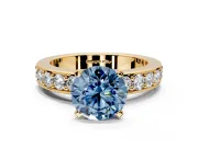 Solitaire Engagement Ring Setting for Fancy Blue Round Cut Center with Channel-Set Accents and Prong Head in Yellow Gold