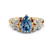 Floral Engagement Ring Setting for Fancy Blue Pear-Shaped Center with Marquise Cluster Shoulders and Prong Head in Yellow Gold