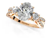 3 Stone Engagement Ring Setting for Oval Center with Pave Split Shank and Prong Head in Rose Gold