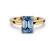 Solitaire Engagement Ring Setting for Fancy Blue Emerald Cut Center with Basket Rail and Prong Head in Yellow Gold