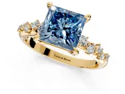 Solitaire Engagement Ring Setting for Fancy Blue Princess Cut Center with Trailing Leaf Accent Band and Prong Head in Yellow Gold