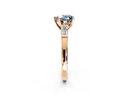 3 Stone Engagement Ring Setting for Fancy Blue Heart-Shaped Center with Channel Baguette Accents and Prong Head in Rose Gold