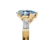 3 Stone Engagement Ring Setting for Fancy Blue Pear-Shaped Center with Tapered Baguettes, Plain Band and Prong Head in Yellow Gold
