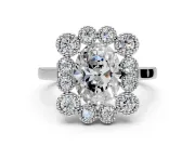 Cluster Halo Engagement Ring Setting for Oval Center with Milgrain Bezel Accents and Prong Head in Platinum