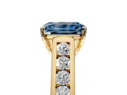 Solitaire Engagement Ring Setting for Fancy Blue Emerald Cut Center with Cathedral Channel Band and Prong Head in Yellow Gold