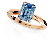Solitaire Engagement Ring Setting for Fancy Blue Emerald Cut Center with Open Cathedral Shoulders and Prong Head in Rose Gold