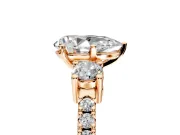 3 Stone Engagement Ring Setting for Pear-Shaped Center with Round Cut Side Accents and Prong Head in Rose Gold