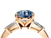 3 Stone Engagement Ring Setting for Fancy Blue Round Cut Center with Channel Baguette Accents and Prong Head in Rose Gold