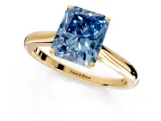 Solitaire Engagement Ring Setting for Fancy Blue Radiant Cut Center with Narrow Cathedral Band and Prong Head in Yellow Gold