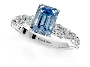 Shared-Prong Engagement Ring Setting for Fancy Blue Emerald Cut Center with Graduated Accents and Prong Head in Sterling Silver