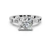 3 Stone Engagement Ring Setting for Princess Cut Center with Channel Baguette Accents and Prong Head in Platinum