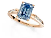Solitaire Engagement Ring Setting for Fancy Blue Emerald Cut Center with Channel Accents and Prong Head in Rose Gold