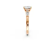 3 Stone Engagement Ring Setting for Princess Cut Center with Channel Baguette Accents and Prong Head in Rose Gold