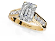 Solitaire Engagement Ring Setting for Emerald Cut Center with Round Cut Channel Band and Prong Head in Yellow Gold