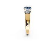 3 Stone Engagement Ring Setting for Fancy Blue Round Cut Center with Raised Basket Heads and Prong Head in Yellow Gold