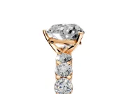 Shared-Prong Engagement Ring Setting for Heart-Shaped Center with Graduated Accents and Prong Head in Rose Gold