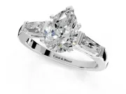 3 Stone Engagement Ring Setting for Pear-Shaped Center with Tapered Baguettes, Plain Band and Prong Head in Sterling Silver