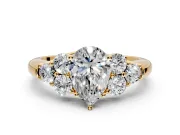 Cluster Engagement Ring Setting for Pear-Shaped Center with Round Cut Accent Frame and Prong Head in Yellow Gold