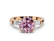 3 Stone Engagement Ring Setting for Fancy Pink Round Cut Center with Channel Baguette Accents and Prong Head in Rose Gold