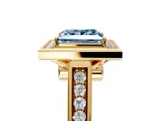 Halo Engagement Ring Setting for Fancy Blue Princess Cut Center with Outer Bezel Rim, Pave Band and Prong Head in Yellow Gold