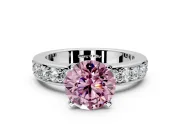 Solitaire Engagement Ring Setting for Fancy Pink Round Cut Center with Channel-Set Accents and Prong Head in White Gold