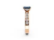 Solitaire Engagement Ring Setting for Fancy Blue Emerald Cut Center with Channel-Set Accents and Prong Head in Rose Gold