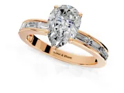 Solitaire Engagement Ring Setting for Pear-Shaped Center with Channel Baguette Band and Prong Head in Rose Gold