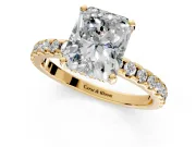 Solitaire Engagement Ring Setting for Radiant Cut Center with Band of Accents and Prong Head in Yellow Gold
