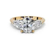 3 Stone Engagement Ring Setting for Round Cut Center with Large Pear-Shaped Accents and Prong Head in Yellow Gold