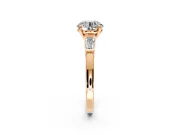 3 Stone Engagement Ring Setting for Round Cut Center with Channel Baguette Accents and Prong Head in Rose Gold