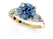 3 Stone Engagement Ring Setting for Fancy Blue Round Cut Center with Large Pear-Shaped Accents and Prong Head in Yellow Gold