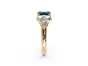 Cluster Engagement Ring Setting for Fancy Blue Emerald Cut Center with Round Cut Accent Frame and Prong Head in Yellow Gold