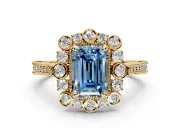 Milgrain Halo Engagement Ring Setting for Fancy Blue Emerald Cut Center with Bezel Point Accents and Prong Head in Yellow Gold