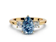 3 Stone Engagement Ring Setting for Fancy Blue Pear-Shaped Center with Wide Plain Band and Prong Head in Yellow Gold