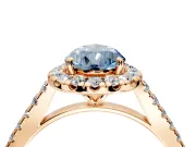 Halo Engagement Ring Setting for Fancy Blue Pear-Shaped Center with Narrowing Pave Band and Prong Head in Rose Gold