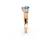 3 Stone Engagement Ring Setting for Fancy Blue Heart-Shaped Center with Raised Basket Heads and Prong Head in Rose Gold