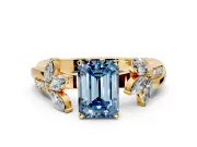 Floral Engagement Ring Setting for Fancy Blue Emerald Cut Center with Trailing Marquise Accents and Prong Head in Yellow Gold