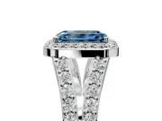 Halo Engagement Ring Setting for Fancy Blue Emerald Cut Center with Narrow Pave Split Shank and Prong Head in Platinum