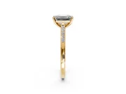 Solitaire Engagement Ring Setting for Emerald Cut Center with Channel Accents and Prong Head in Yellow Gold