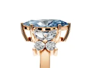 Floral Engagement Ring Setting for Fancy Blue Marquise Center with Marquise Cluster Shoulders and Prong Head in Rose Gold