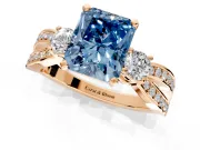 3 Stone Engagement Ring Setting for Fancy Blue Radiant Cut Center with Pave Twist Band and Prong Head in Rose Gold
